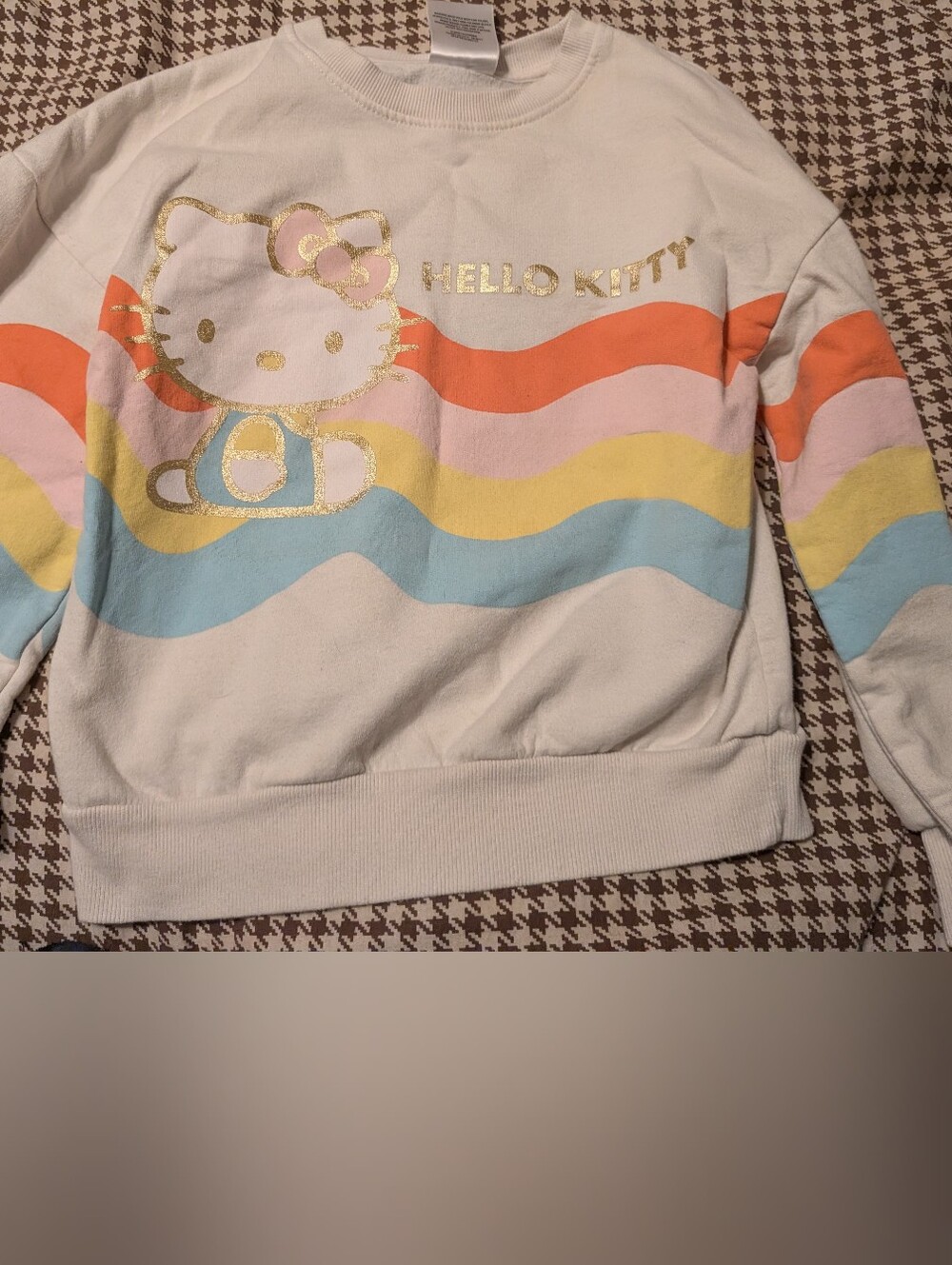 Hello Kitty Cream Sweatshirt with Pastel Rainbow Waves and Gold Foil